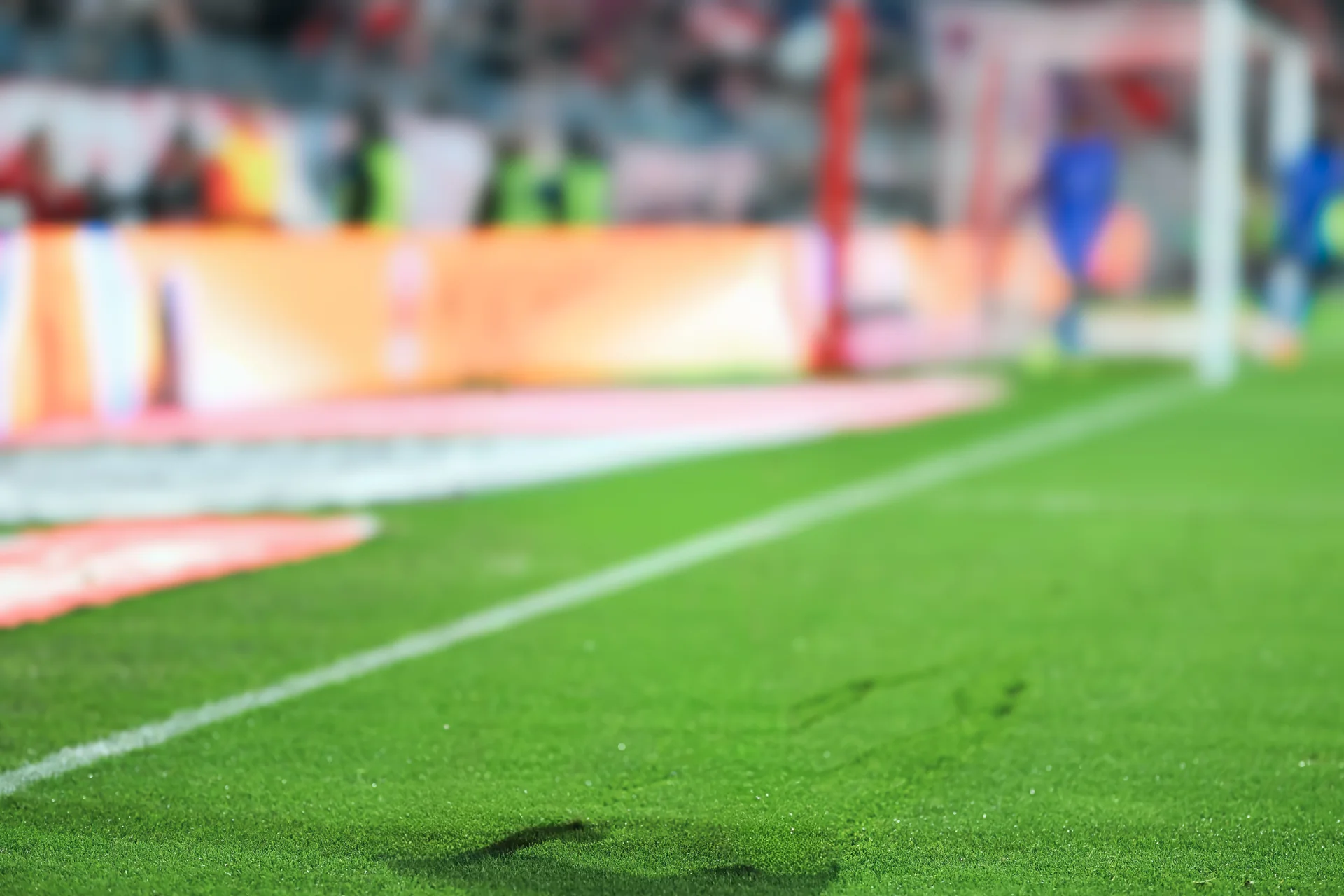 Serge Gnabry in FC Bayern Munich kit celebrating in front of Allianz Arena - represented by ROOF Football Agency.